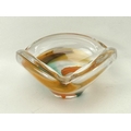 A Scandinavian glass bowl, mid 20th century, the free form triangular clear glass with enclosed oran... 