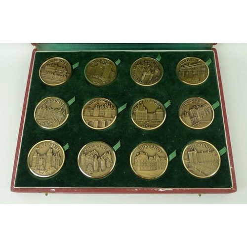 693A - A set of twelve French bronze medallions of Chateaux in the Val de Loire, in a presentation box.