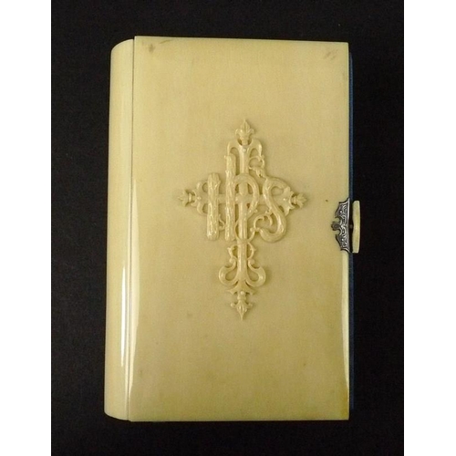 697 - An ivory bound book, 'The Book of Common Prayer', 19th century, with raised motif to front cover, si... 