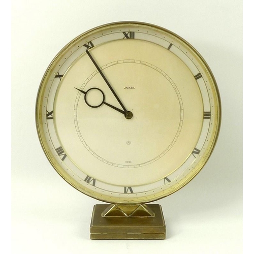 699A - An Art Deco Jaeger time piece, mantel clock, brass framed, Roman numerals, circular dial upon a pyra... 