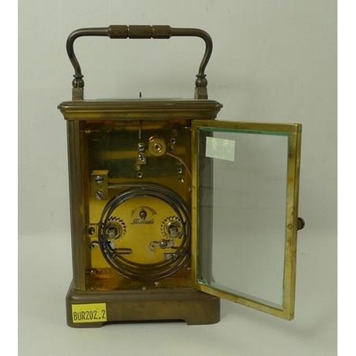 700 - A brass cased repeating carriage clock, the white enamel dial with Roman numerals, bevelled glass, a... 