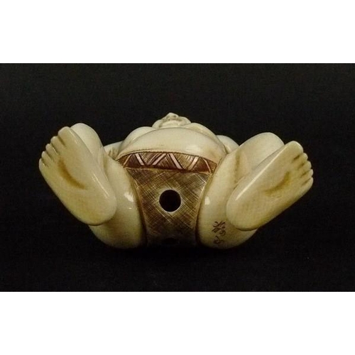 704 - A late 19th/early 20th century Japanese ivory netsuke, modelled as a sumo wrestler, signed to base, ... 