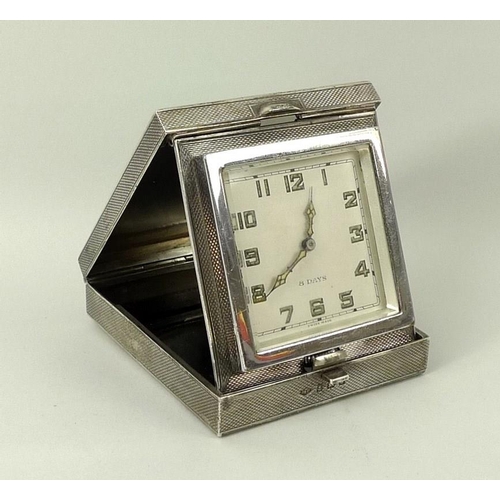 707A - A George V silver cased travelling clock, with 8 day manual wind Swiss Buren 15 jewel movement set i... 