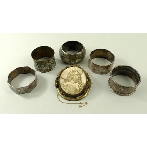 715 - A group of three Vilnius silver napkin rings, two further napkin rings, and a 19th century ivory cam... 