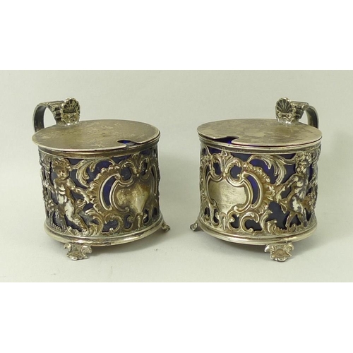 720A - A pair of silver salts, cast with cherubs, having blue liners, Sheffield 1899, Richard Martin and Eb... 