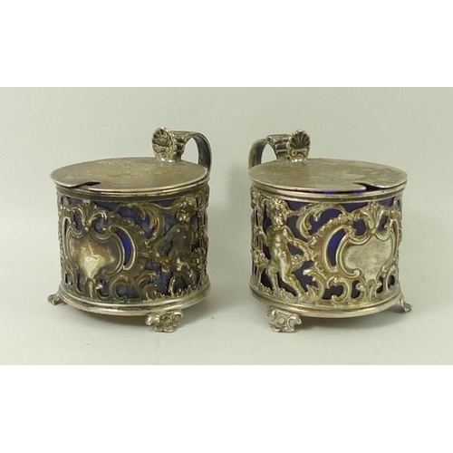 720A - A pair of silver salts, cast with cherubs, having blue liners, Sheffield 1899, Richard Martin and Eb... 