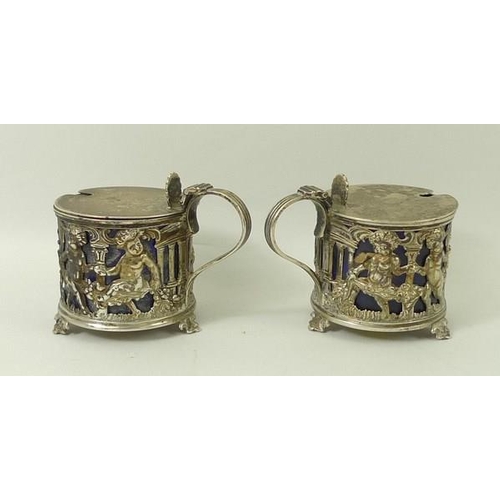 720A - A pair of silver salts, cast with cherubs, having blue liners, Sheffield 1899, Richard Martin and Eb... 