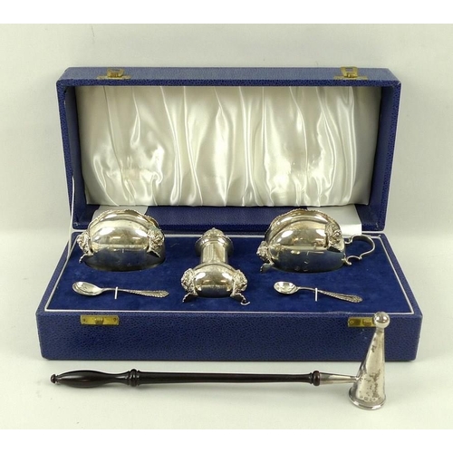 721 - An Elizabeth II silver cruet set, comprising salt cauldron with blue glass liner, raised on three ha... 