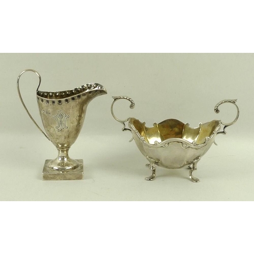 722 - A Victorian silver cream jug, with punch beaded rim on square base, Chester 1896, 10cm, and a Scotti... 