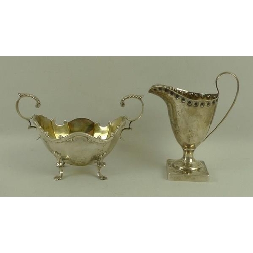 722 - A Victorian silver cream jug, with punch beaded rim on square base, Chester 1896, 10cm, and a Scotti... 