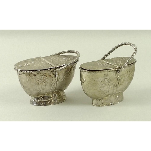 723 - A Dutch silver salt in the form of a basket with hinged lid, decorated with harvest scenes and cavor... 