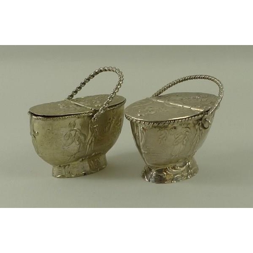 723 - A Dutch silver salt in the form of a basket with hinged lid, decorated with harvest scenes and cavor... 