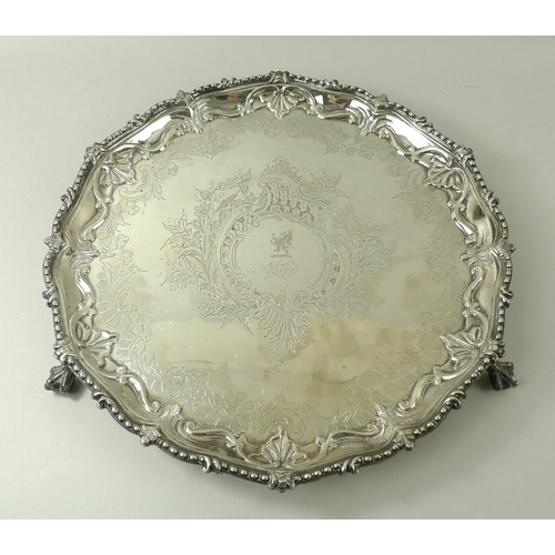 727 - A silver salver, with cast bead and leaf rim, the reserve with a griffin, on ball and claw feet, She... 