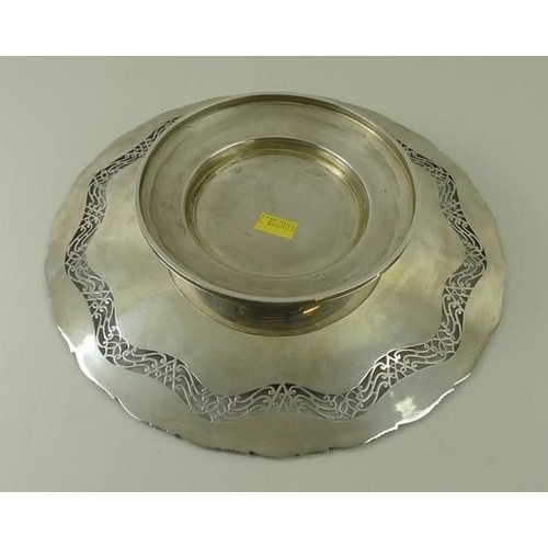 736 - A silver circular cake plate, fret cut band and applied cast rim, raised on a circular foot, Sheffie... 