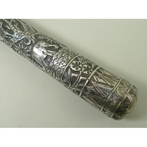 741 - An Indian silver metal parasol handle, deeply engraved with forest animals, 34cm.