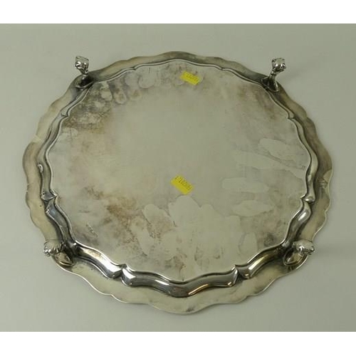 744 - A silver salver, Chippendale piecrust edge, raised on four ball and claw feet, Sheffield 1924, James... 