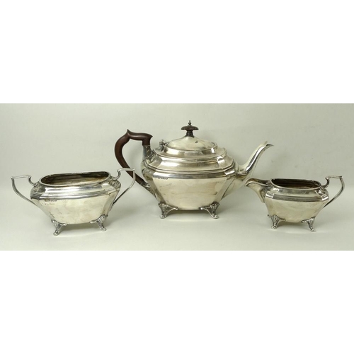 747 - An Edwardian three piece silver tea set, of oblong form with canted corner, comprising teapot with B... 