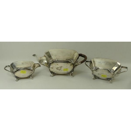 747 - An Edwardian three piece silver tea set, of oblong form with canted corner, comprising teapot with B... 