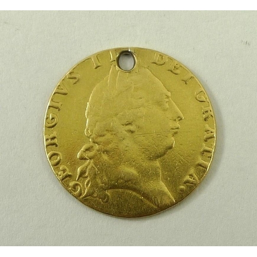 764 - A Georgian guinea 1791, drilled.