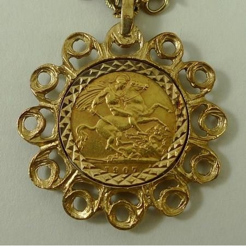 768 - An Edward VII gold half sovereign, 1907, in a 9ct gold pendant mount with gold link chain.