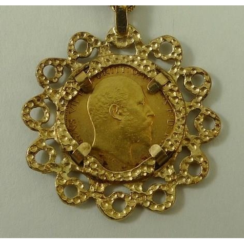 768 - An Edward VII gold half sovereign, 1907, in a 9ct gold pendant mount with gold link chain.