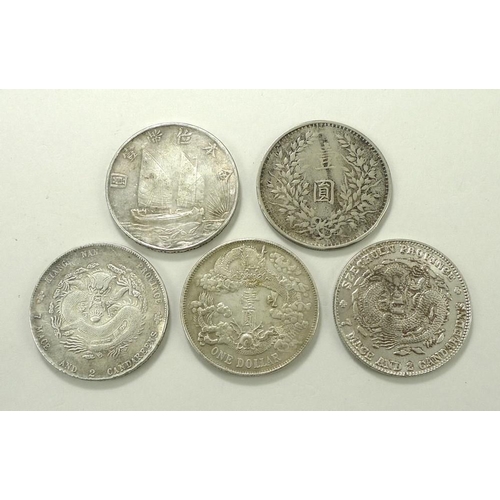 769 - A group of five Chinese silver and white metal trade dollars, late 19th and early 20th century, comp... 