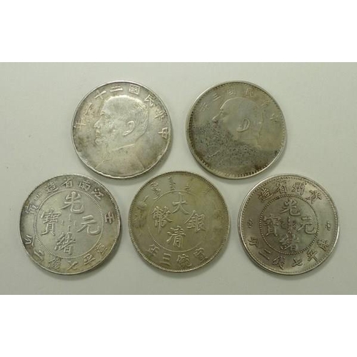 769 - A group of five Chinese silver and white metal trade dollars, late 19th and early 20th century, comp... 