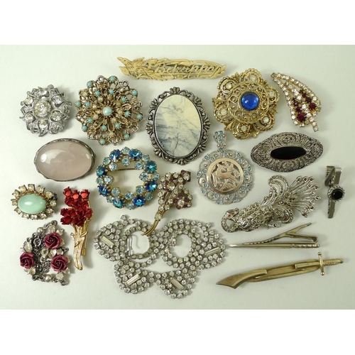 774 - A collection of costume jewellery comprising fourteen brooches set with coloured and paste stones, t... 