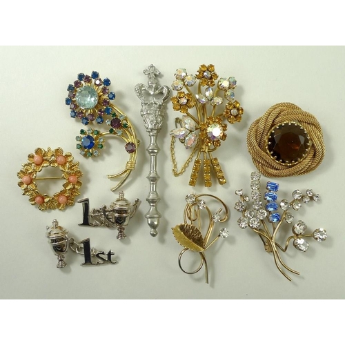 775 - A quantity of costume jewellery comprising a pair of sterling silver cufflinks in the form of a trop... 