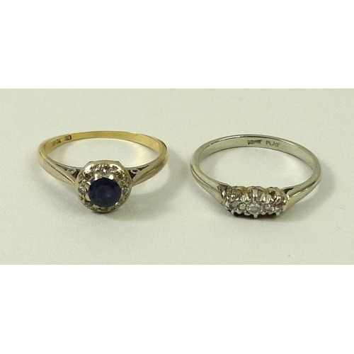 783 - An 18ct gold, sapphire and diamond ring, the central circular sapphire surrounded eight chip diamond... 