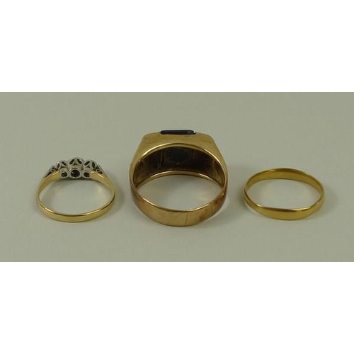 789 - A 22ct wedding band, 1.8g, size M, a yellow metal (tests at least 22ct) and three stone set ring, si... 