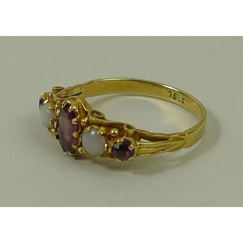 792 - A 15ct gold, amethyst and opal ring, the central oval cut amethyst flanked by two opals, and two ame... 