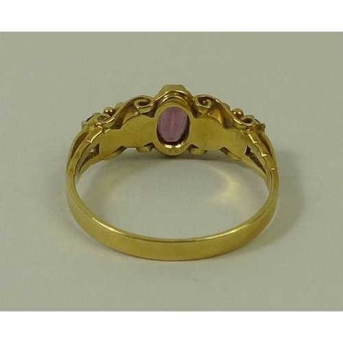 792 - A 15ct gold, amethyst and opal ring, the central oval cut amethyst flanked by two opals, and two ame... 