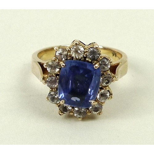 796 - A 9ct gold and sapphire ring in a surround of white sapphires, approximately 3ct, size N, 5.7g total... 