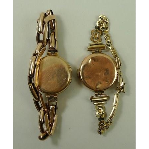 801 - A lady's 9ct gold wristwatch, with Arabic numerals and subsidiary dial, on an expanding bracelet, to... 