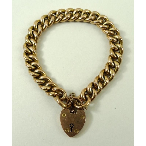 802 - A 9ct gold link bracelet with pad lock clasp and safety chain, 20.2g.