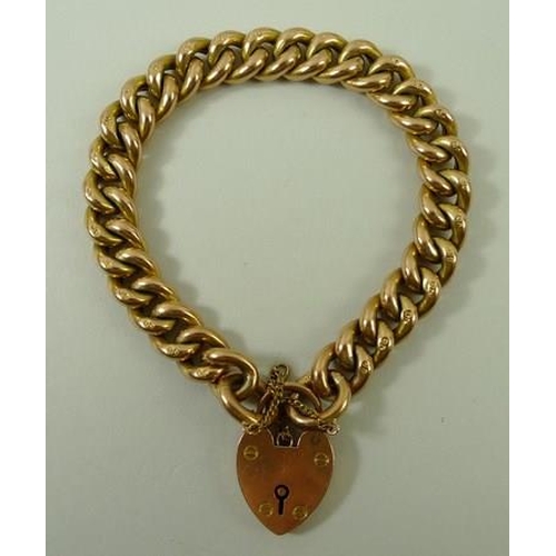 802 - A 9ct gold link bracelet with pad lock clasp and safety chain, 20.2g.