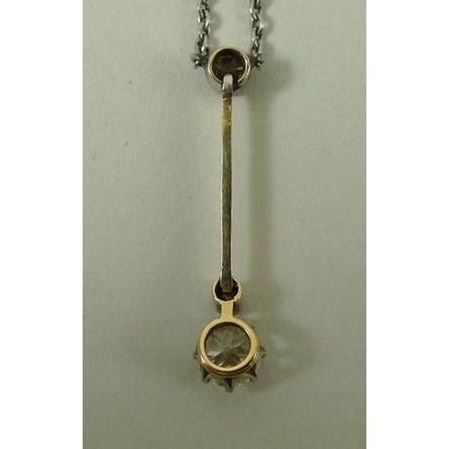 803 - An unmarked gold pendant necklace, set with a 0.5ct diamond on a slender bar, and two further smalle... 