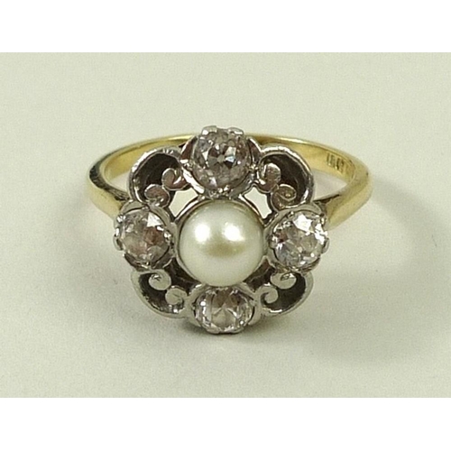 814 - An 18ct gold and platinum set diamond and pearl ring, the central pearl, 4mm, with a 0.2ct diamond s... 