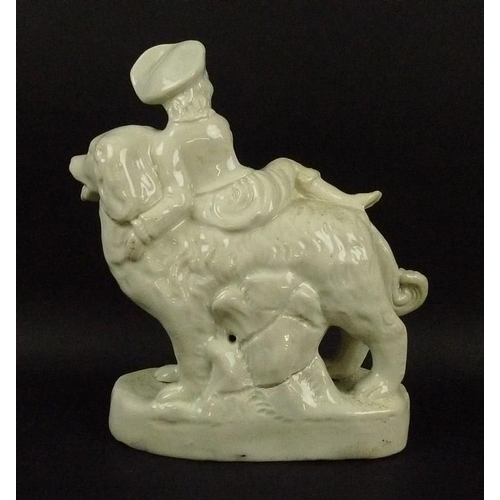 504 - A Staffordshire pearlware figure, mid 19th century, modelled as a boy sitting on a large dog, on an ... 