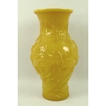 A Chinese yellow glass baluster vase, 19th century, with flared rim, carved in low relief with camel... 