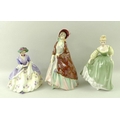 A group of Royal Doulton figurines comprising 'The Paisley Shawl', HN1392, 'Griselda', HN1993, and '... 