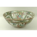 A Canton porcelain bowl with polychrome reserves, decorated to the interior and exterior with four r... 