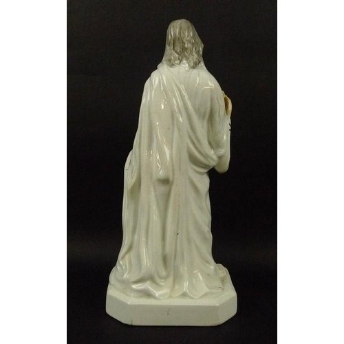 524 - A Staffordshire pearlware figure, mid to late 19th century, modelled as Jesus, dressed in long robes... 