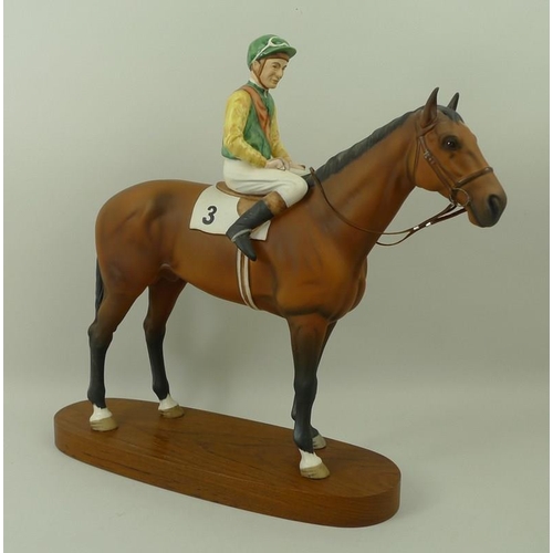 531 - A Beswick ceramic figurine, 'Lester Piggott on Nijinsky', on a wooden oval base, 32cm.