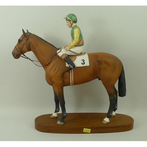 531 - A Beswick ceramic figurine, 'Lester Piggott on Nijinsky', on a wooden oval base, 32cm.