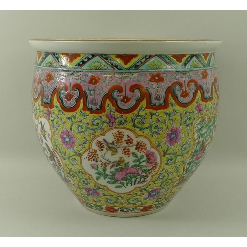 534 - A Chinese famille verte fish bowl, 19th century, the exterior painted with exotic birds below green ... 