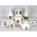 A collection of W. H. Goss crested ware, including vases, bowls, vases, ewers, tyg, teapot, and nove... 