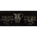 A Bohemian Waldglass cut glass water set, comprising a jug, 18cm, and six goblets, 13cm, with cut po... 