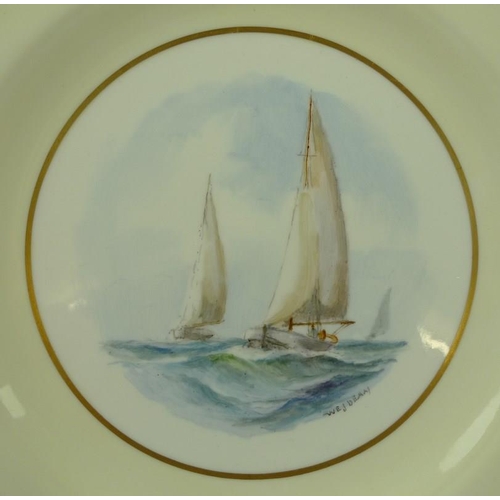 545 - A pair of Royal Crown Derby plates, each depicting yachts at sea, titled verso 'Endymion' and 'Vagab... 